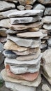 Stack of Natural Stone Slabs Creating a Rustic and Textured Outdoor Garden Feature Royalty Free Stock Photo
