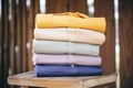 stack of naturally dyed cotton shirts on wood Royalty Free Stock Photo