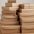 A stack of neatly arranged brown cardboard boxes of various sizes Royalty Free Stock Photo