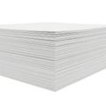 A stack of neatly arranged white paper sheets with intricate dotted patterns Royalty Free Stock Photo