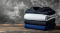 Stack of Folded V Neck Shirts on Weathered Wooden Surface Royalty Free Stock Photo