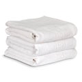 A stack of neatly folded clean fluffy white towels isolated Royalty Free Stock Photo