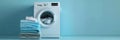 A stack of neatly folded, clean laundry sits beside a white washing machine against a blue wall. Generative AI Royalty Free Stock Photo