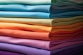 Stack of neatly folded colorful clothes or fabric