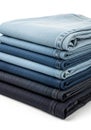 A stack of neatly folded denim jeans in varying shades of blue, ranging from light to Royalty Free Stock Photo