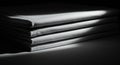 A stack of neatly folded white fabric sheets is illuminated by a focused beam of light Royalty Free Stock Photo