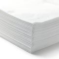 Stack of neatly folded white paper sheets on a flat surface Royalty Free Stock Photo