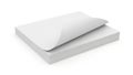Stack of neatly folded white paper sheets on a flat surface Royalty Free Stock Photo