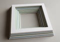 A stack of nested, square paper cutouts with varying frame widths. Each piece features alternating Royalty Free Stock Photo