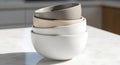 Stack of Neutral Ceramic Bowls on Marble Surface. Royalty Free Stock Photo