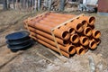 Stack of new plastic drainage pipes at construction site Royalty Free Stock Photo