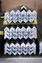 A stack of new steel angle bars stockpiled in a warehouse. closeup shot Royalty Free Stock Photo