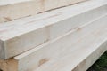 Stack of new wooden studs at a lumber yard, warm color retro tone selective focus image Royalty Free Stock Photo
