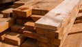Stack of new wooden studs at a lumber yard warm color tone selective focus. Royalty Free Stock Photo