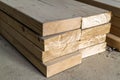 Stack of new wooden studs at the lumber yard. Wood timber construction material. Shallow depth of field effect Royalty Free Stock Photo