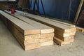 Stack of new wooden studs at the lumber yard. Wood timber constr Royalty Free Stock Photo