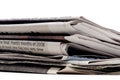 Stack of newpapers on a white background Royalty Free Stock Photo