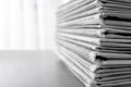 Stack of newspapers on grey table, space for text. Journalist`s work Royalty Free Stock Photo