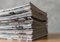 Stack of Newspapers and Magazines on Wooden Table Close up View Royalty Free Stock Photo