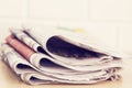 Stack of newspapers on table Royalty Free Stock Photo