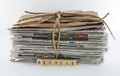 Stack of Newspapers Tied With Twine-Recycle