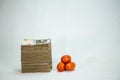 Stack of nigeria naira notes and tomatoes - increase in food commodity Royalty Free Stock Photo