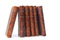 Stack of nine antique books, isolated white background Royalty Free Stock Photo