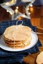 Stack of Norwegian crispy round waffles Krumkake on a tray