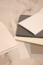 white and black notebook, color sheets on gray background Royalty Free Stock Photo