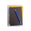 Stack of notebooks or copybooks with pencil on top Royalty Free Stock Photo