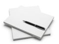 Stack of notepads with pen isolated on white background Royalty Free Stock Photo