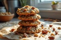 Stack of oatmeal cookies with nuts in sunlit kitchen Royalty Free Stock Photo