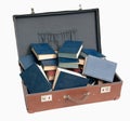 Stack of old blue books in brown suitcase Royalty Free Stock Photo