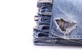 Stack of old blue jeans isolated on white Royalty Free Stock Photo