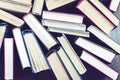 Stack of old book on wooden floor - education concept background, many books piles with copy space for text Royalty Free Stock Photo