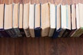 Stack of old book on wooden table, education concept background, many books piles with copy space for text