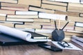 Stack of old book on wooden table, laptop computer, notebook, smartphone, stationery and paperweight. Education writer concept Royalty Free Stock Photo