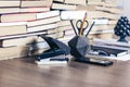 Stack of old book on wooden table, notebook, smartphone, stationery and paperweight. Education writer concept background Royalty Free Stock Photo