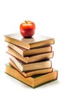 Stack of Old Books With an Apple on Top Royalty Free Stock Photo