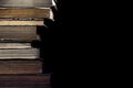 Stack of old books on the black background Royalty Free Stock Photo