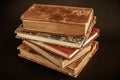 Stack of old books on black background Royalty Free Stock Photo