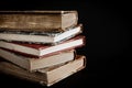 Stack of old books on black background Royalty Free Stock Photo