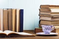 Stack of old books on a blue wooden background. Royalty Free Stock Photo