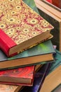 Stack of old books with colorful ancient bindings Royalty Free Stock Photo
