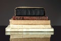Stack of old books on dark