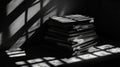 Stack of Old Books in Dramatic Light and Shadow Royalty Free Stock Photo