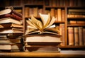 A stack of old books and flying book pages against the background of the shelves in the library Royalty Free Stock Photo