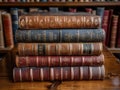 A stack of old books on table against background of bookshelf in library. Ancient books as a symbol of knowledge