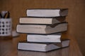 Stack of old books on the table side view Royalty Free Stock Photo