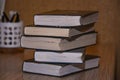 Stack of old books on the table side view Royalty Free Stock Photo